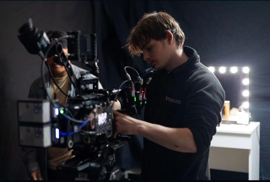 Charlie Hedger adjusting cables on a Sony Venice Cinema Camera.